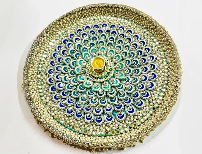 Past entry: peacock-feather pattern thali in gold and blue