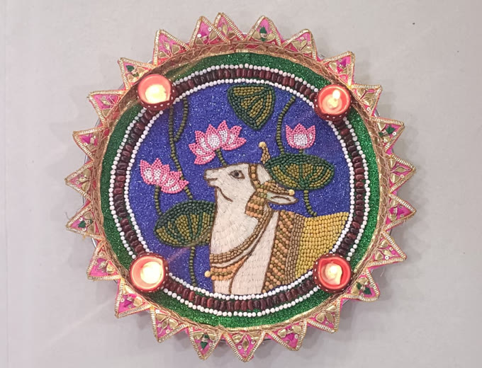 Past entry: beaded Nandi and lotus thali with four diyas
