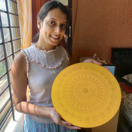 Participant mid-way through decorating a thali