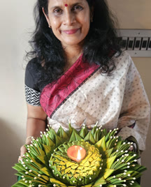Participant holding a finished leaf thali