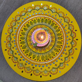 Top view of a decorated yellow thali