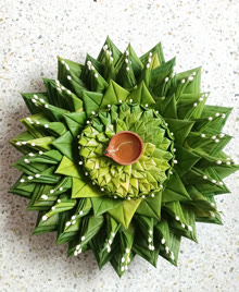 Top view of a leaf-decorated thali